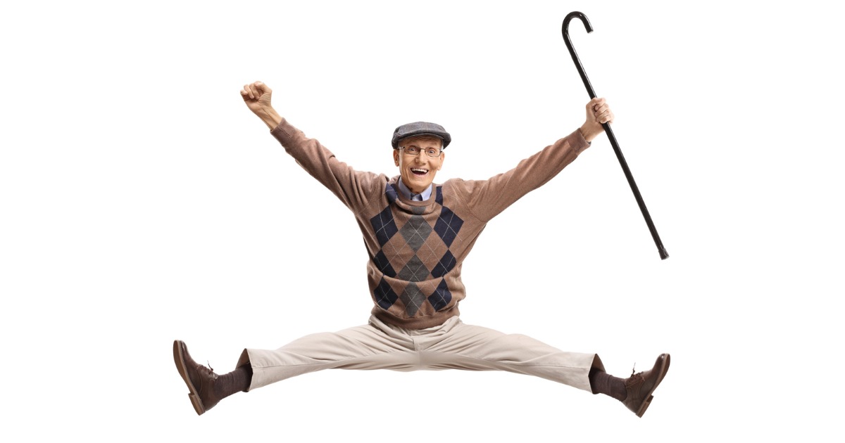 Overjoyed Man With Cane Jumping