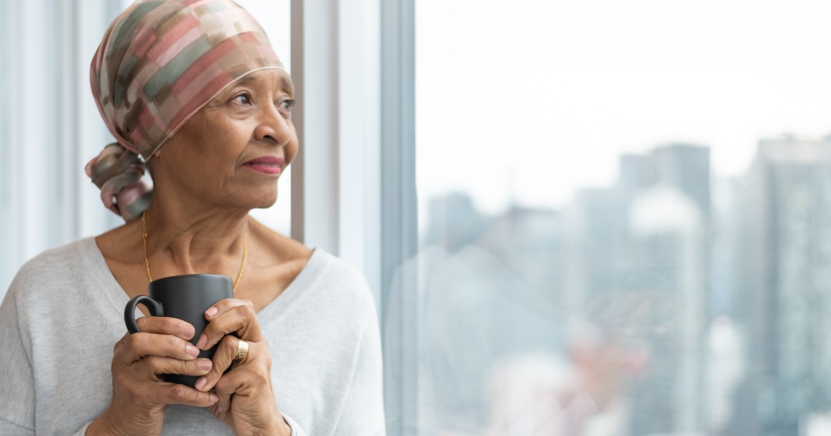 Portrait Senior Woman With Cancer Looking Out Window